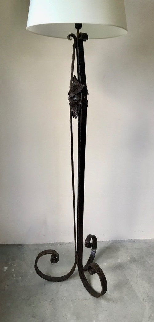 Art Deco wrought-iron floor lamp with flower design, circa 1930.