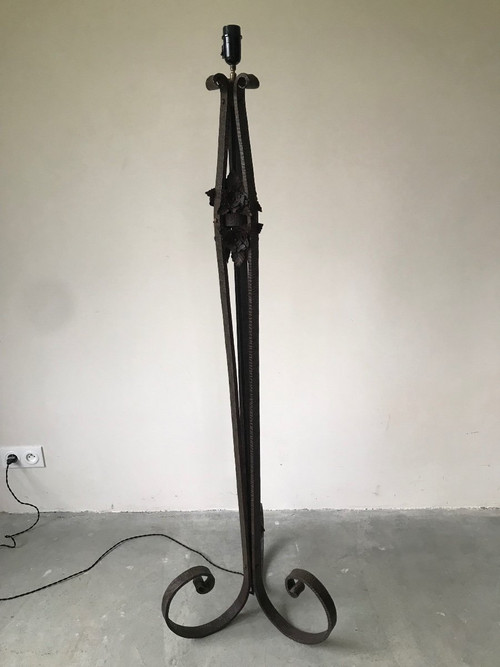 Art Deco wrought-iron floor lamp with flower design, circa 1930.