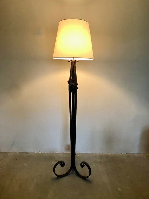 Art Deco wrought-iron floor lamp with flower design, circa 1930.