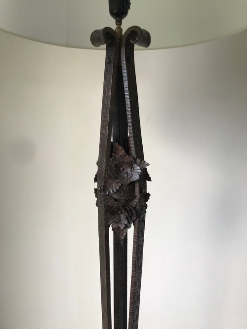Art Deco wrought-iron floor lamp with flower design, circa 1930.