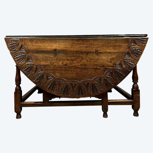 Gateleg table in carved solid walnut, 17th century circa 1650