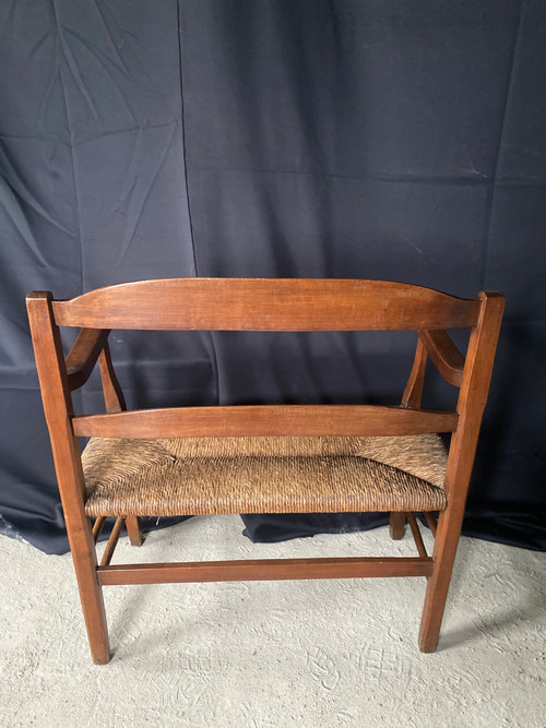 Fireplace bench with backrest dating from the 19th century