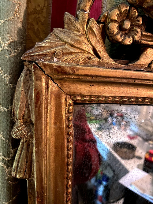 Incantevole specchio Luigi XVI in legno dorato con covone di grano e faretra , XVIII secolo
