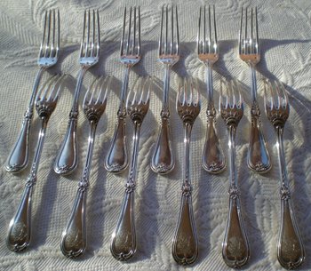 12 solid silver dessert cutlery
