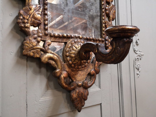 Italian Mirror With Arms Of Light In Carved And Gilded Wood. 18th century period