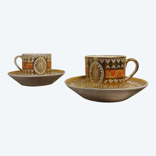 Paris, Revolution or Empire period - pair of litron cups and saucers - rich gilded decoration and nankin background