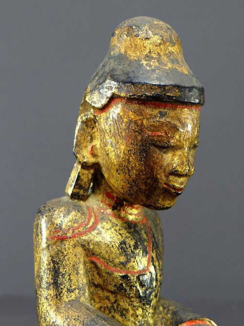 Burma, 19th century, Mandalay Buddha in carved and gilded wood on a black lacquer background.