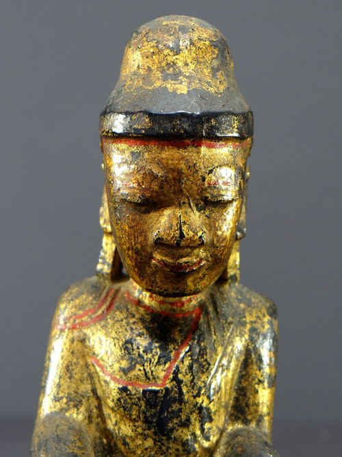 Burma, 19th century, Mandalay Buddha in carved and gilded wood on a black lacquer background.