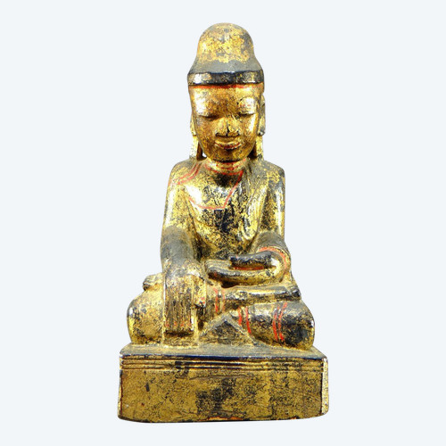 Burma, 19th century, Mandalay Buddha in carved and gilded wood on a black lacquer background.
