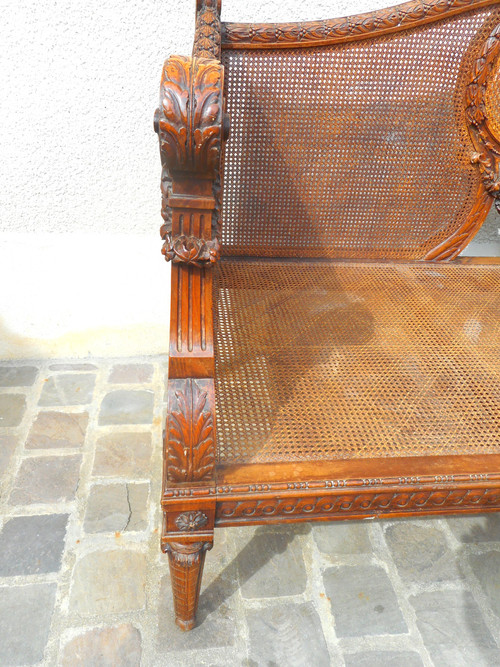 Divano intagliato in noce e canna, epoca Napoleone III