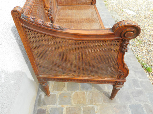 Divano intagliato in noce e canna, epoca Napoleone III
