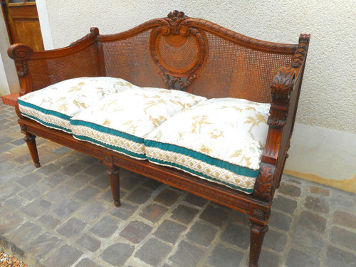 Divano intagliato in noce e canna, epoca Napoleone III