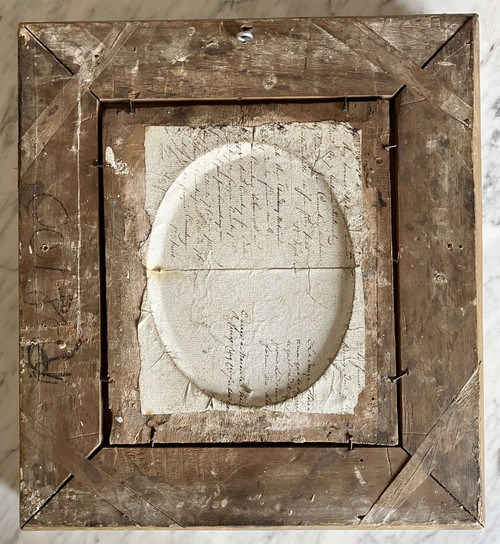 Antique cameos in an Empire frame, souvenir of the Grand Tour on a porphyry background
