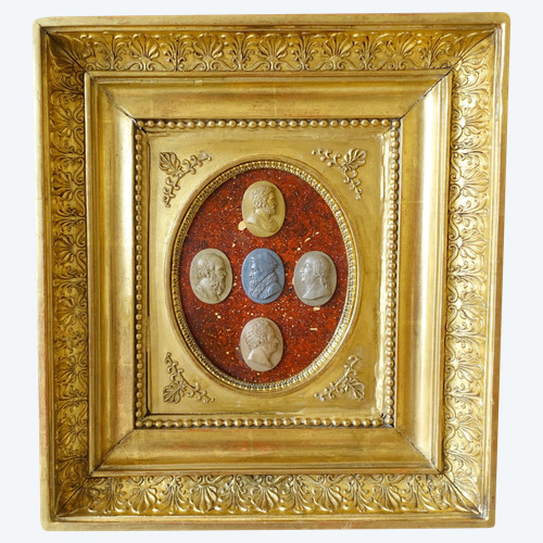 Antique cameos in an Empire frame, souvenir of the Grand Tour on a porphyry background