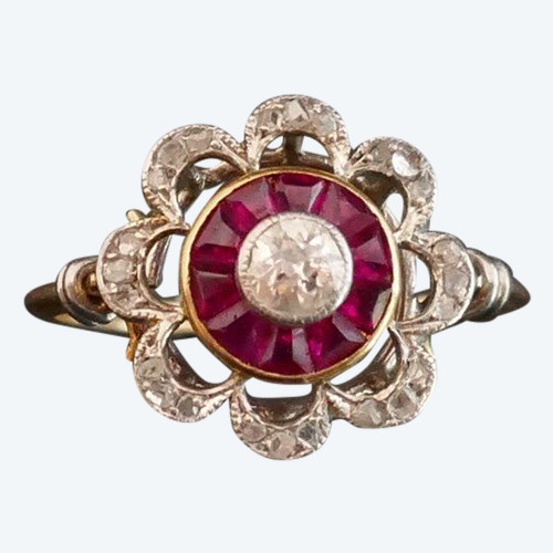Bague Ornée d'Un Diamant, Entourage De Rubis Calibrés.