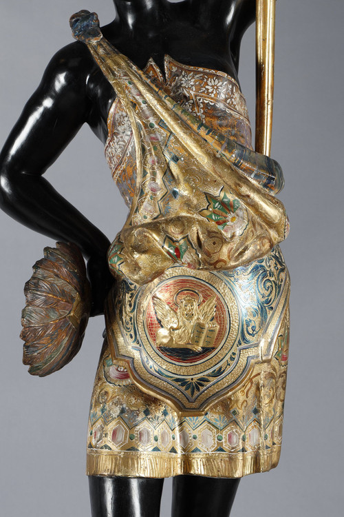 PAIR OF BLACK AND POLYCHROME LACQUERED WOOD TORCHHOLDERS DEPICTING NUBIANS