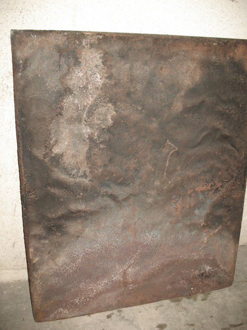 Large cast-iron fireback from the 18th century decorated with coat of arms and lyre
