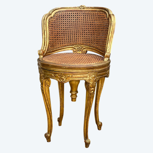 FAUTEUIL TOURNANT COURBÉ EN BOIS DORÉ ET CANNAGE DU XIXe DE STYLE LOUIS XV