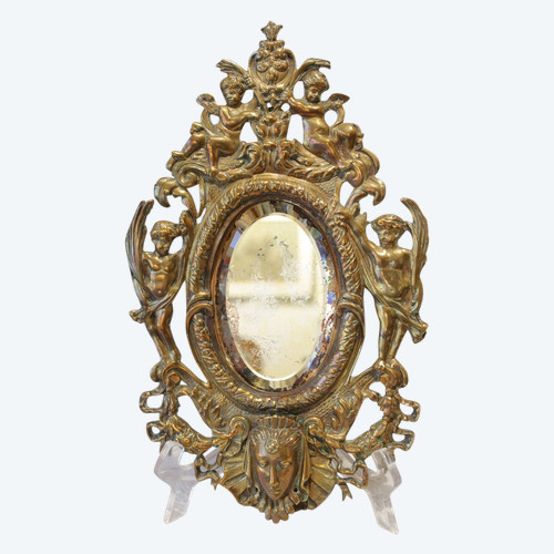 Specchio in bronzo decorato con putti e mascaroni fine XIX secolo