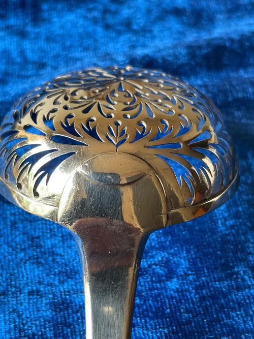 Solid silver shaker.
