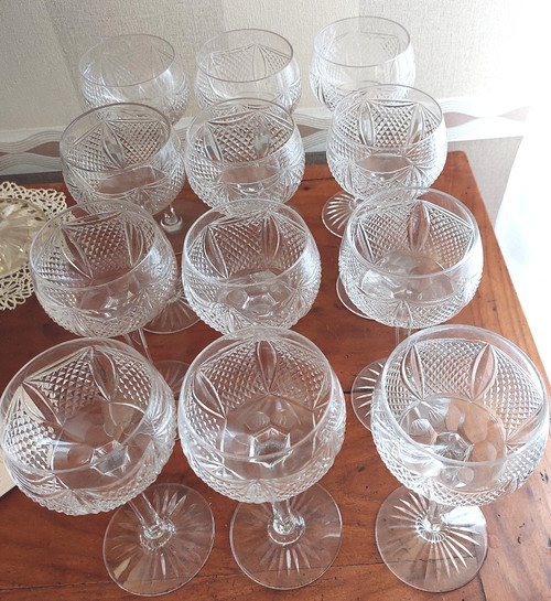 Series of 12 cut crystal stemmed wine glasses from the early 20th century