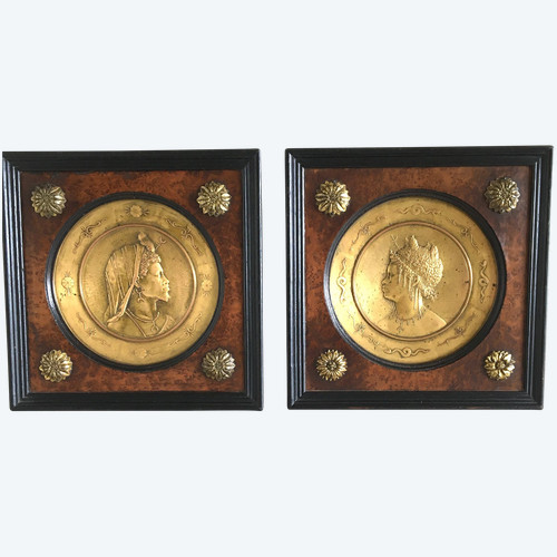 Pair of chased and gilded copper medallions, signed P. Faraoni (1869)