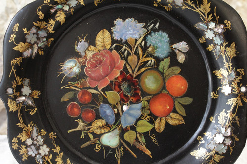 Rounded platter in painted black pressed material with mother-of-pearl inlay late 19th century