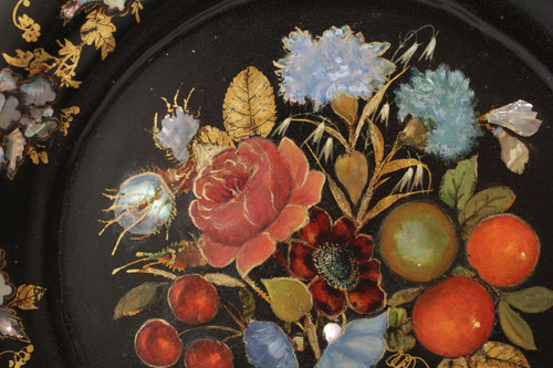 Rounded platter in painted black pressed material with mother-of-pearl inlay late 19th century