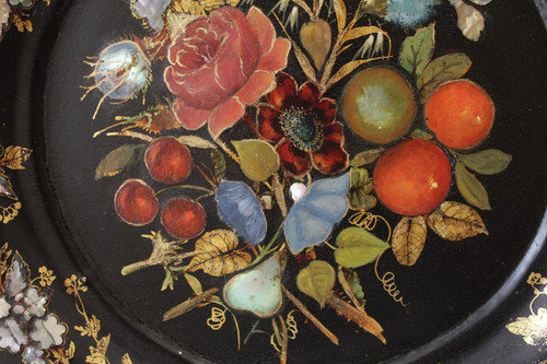 Rounded platter in painted black pressed material with mother-of-pearl inlay late 19th century