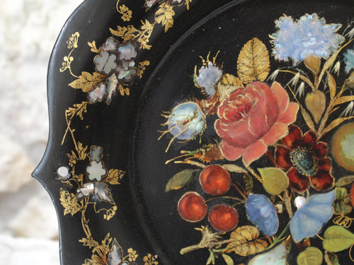 Rounded platter in painted black pressed material with mother-of-pearl inlay late 19th century