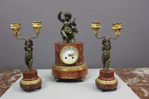 Borne Clock Surmounted by a Putti About 1880