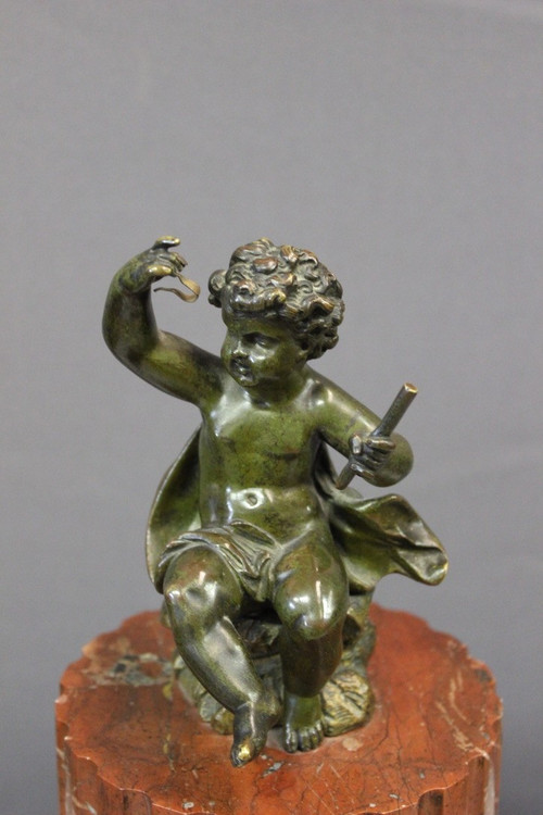 Borne Clock Surmounted by a Putti About 1880