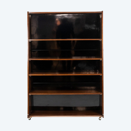 Libreria bifacciale con rotelle in palissandro. Circa 1960. LS58761008H