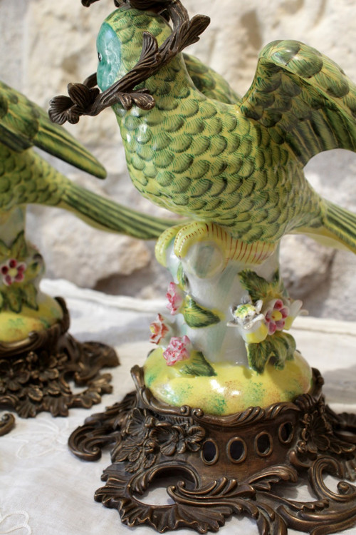 Pair of earthenware parrots forming torches with bronze mounts 20th century
