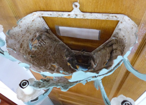 Cornet-shaped wall light in wrought iron with patinated foliage, 1930s period