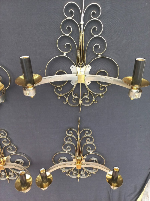 Suite di quattro lampade da parete in ottone dorato, circa 1940
