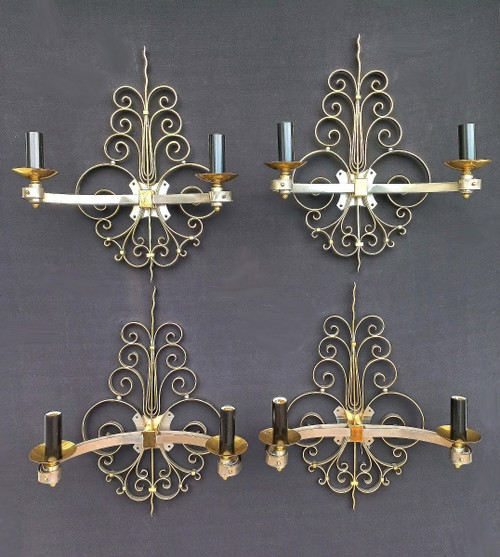 Suite di quattro lampade da parete in ottone dorato, circa 1940