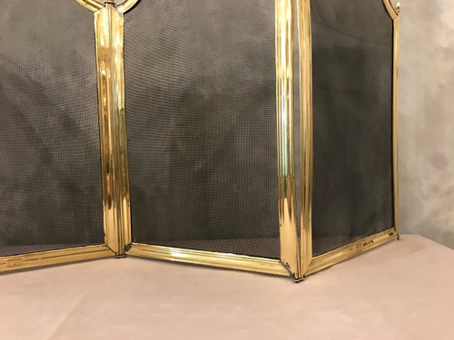 Old fireplace screen in polished brass and varnish from the 19th Louis Philippe period 