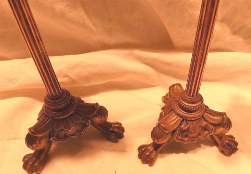 Coppia di candelieri impero in bronzo con piedini ad artiglio di leone