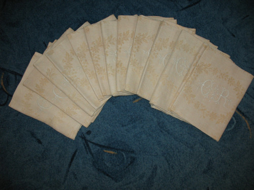 12 napkins in cream floral damask with CR embroidered initials from the early 20th century