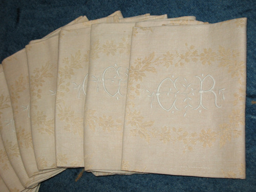 12 napkins in cream floral damask with CR embroidered initials from the early 20th century
