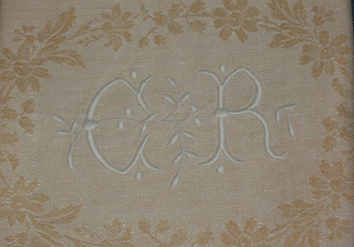12 napkins in cream floral damask with CR embroidered initials from the early 20th century