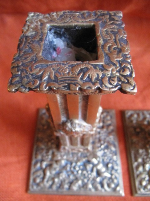 Pair of bronze candlesticks decorated with cherubs 19th century