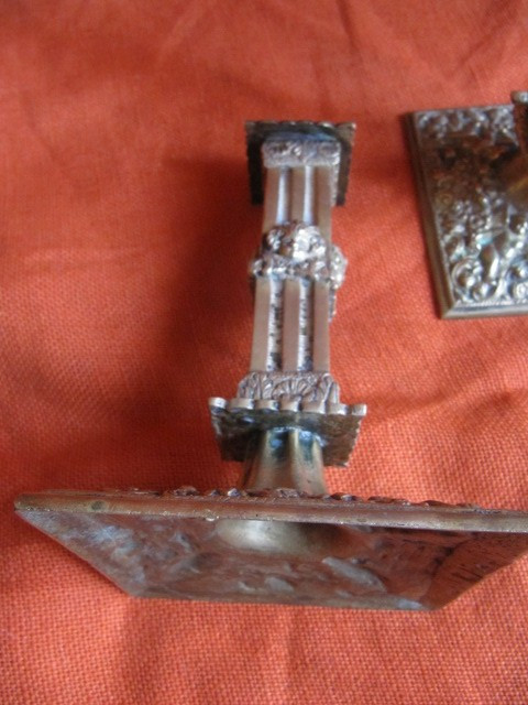 Pair of bronze candlesticks decorated with cherubs 19th century