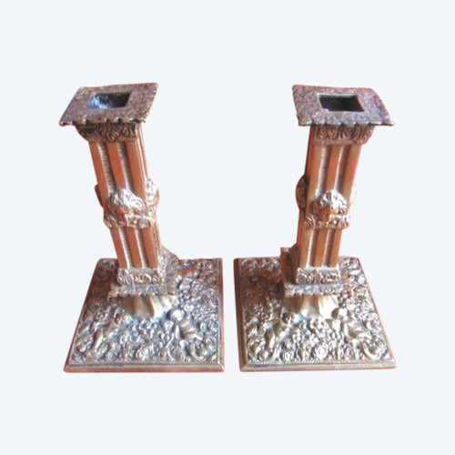 Pair of bronze candlesticks decorated with cherubs 19th century