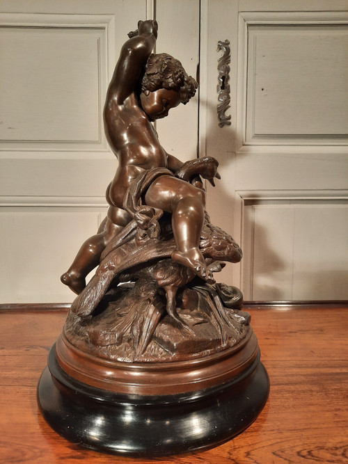 Sculpture en régule d’époque XIXème siècle représentant un putti chevauchant un cygne.