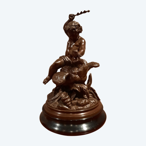 Sculpture en régule d’époque XIXème siècle représentant un putti chevauchant un cygne.
