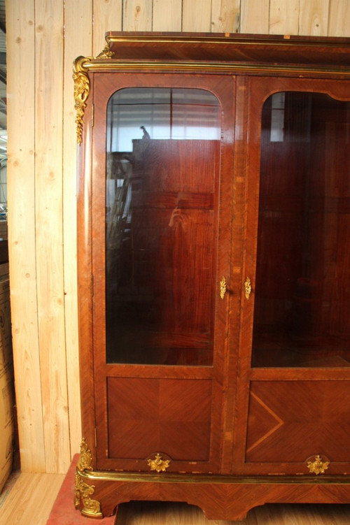 Grande libreria in bronzo dorato e impiallacciato, XIX secolo