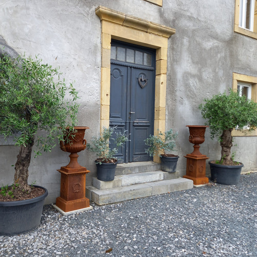 Two Large Medici Vases on their cast iron bases 