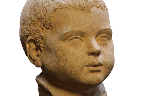 Scultura in terracotta rappresentante testa di bambino 